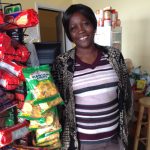 Rebecca standing next to plantain chips. She owns an African grocery stroe in Kirksville, MO.