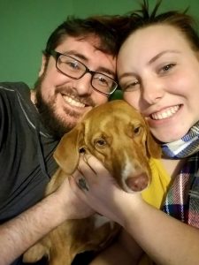Christa with her husband Mitchell and their puppy